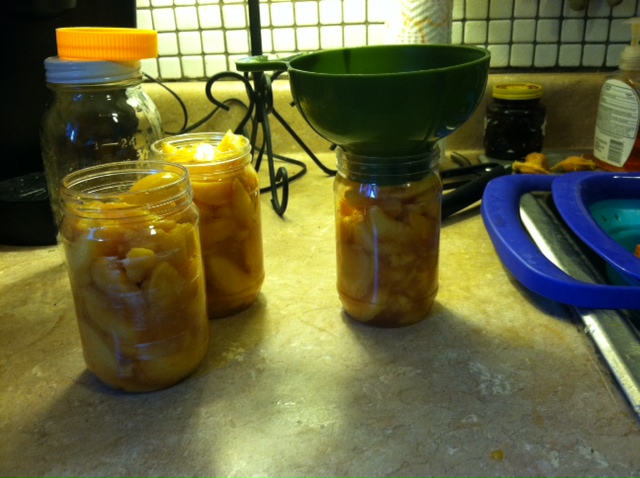 filling peach jars